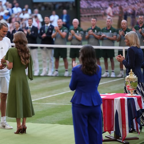 Britain's Princess Kate presents the runner-up trophy to Alexander Zverev of Germany after his match against Jannik Sinner of Italy in the men's singles final at Wimbledon Tennis Championships in London, Sunday, July 12, 2026. (AP Photo/Kirsty Wigglesworth)