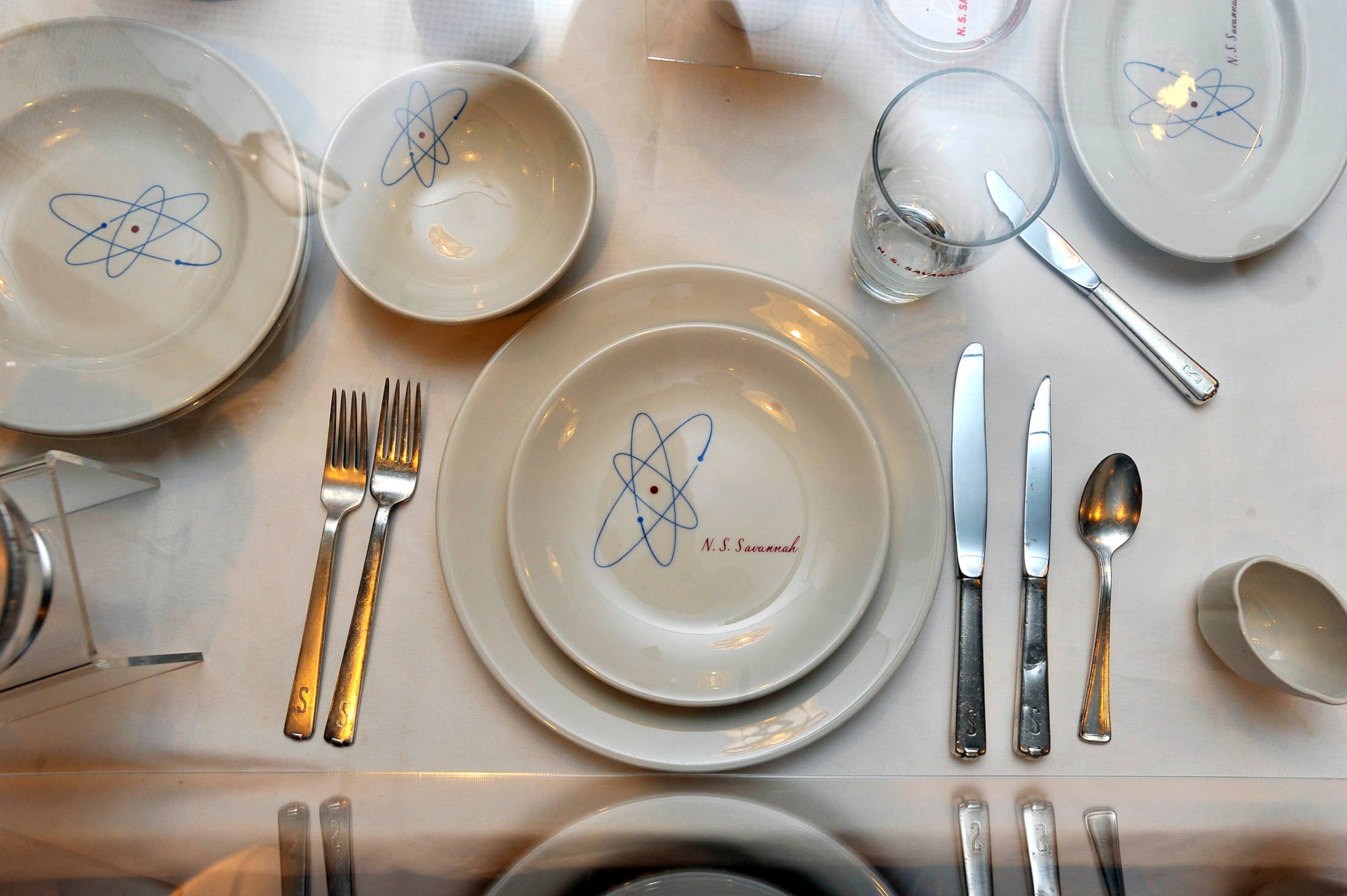 Atomic-themed plates and silverware used in the early 1960s are displayed on the NS Savannah. (Kim Hairston/TNS/Getty Images 2011)