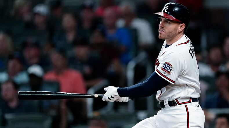 Freddie Freeman watches his home run during the sixth inning of Wednesday's game against the Red Sox. The Braves would eventually fall 10-8 and drop both games of their short two-game series against Boston.