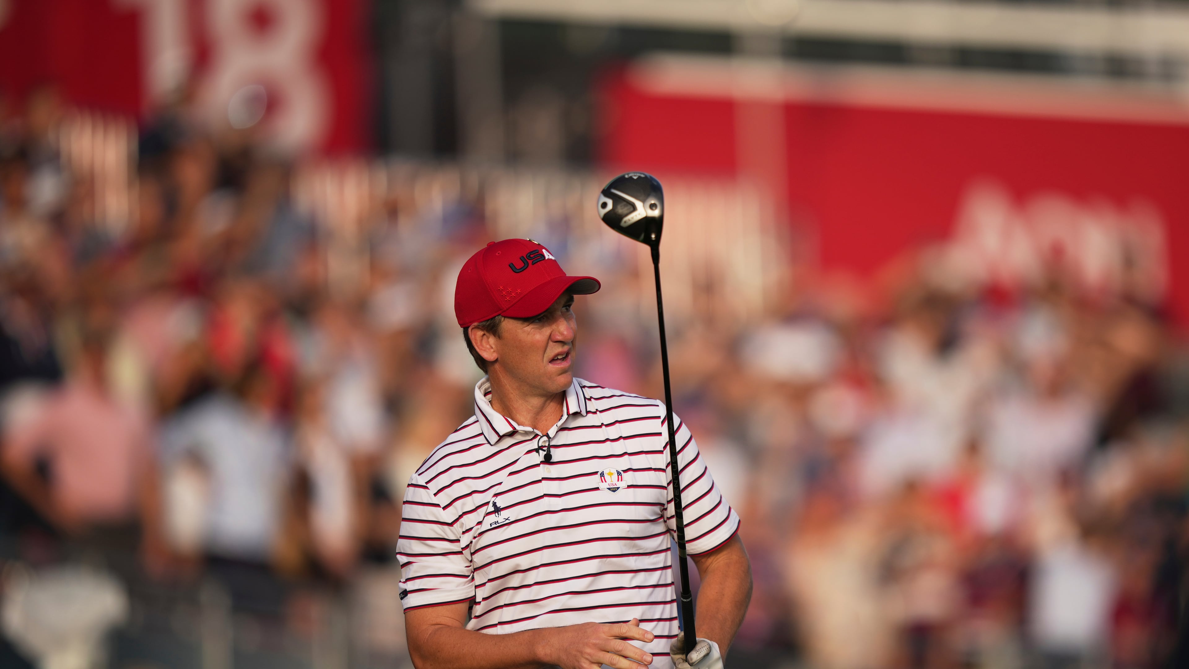 United States' Eli Manning watches his tee shot on the first hole during the celebrity Ryder Cup golf tournament, Wednesday, Sept. 24, 2025, on the Bethpage Black golf course, in Farmingdale, N.Y. (AP Photo/Matt Slocum)