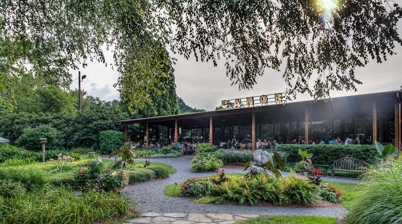 Diners relax on the lush grounds of acclaimed restaurant Canoe. Courtesy of Canoe.