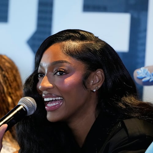 Angel Reese speaks during her introduction during a news conference by the Atlanta Dream on Friday, April 17, 2026, in Atlanta. The Dream acquired Reese for first-round draft picks in 2027 and 2028. (AP Photo/Brynn Anderson)