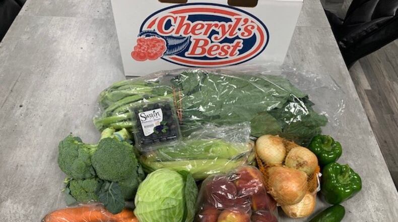 Each package distributed Friday will include 20 pounds of fruits and vegetables and 10 pounds of frozen chicken, officials said. SPECIAL PHOTO / DEKALB COUNTY