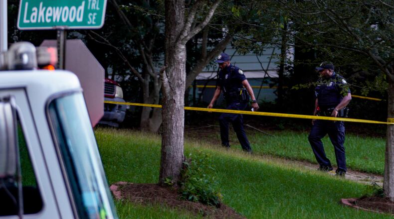 Atlanta police officers investigate a fatal shooting on Wyndham Way on Sunday evening. According to police, a 65-year-old man was killed at a home.