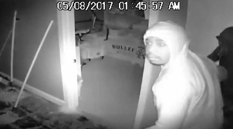 Police in Sandy Springs are searching for this suspect and a few others in relation to a liquor store burglary.