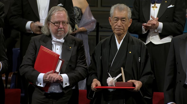 Jim Allison, left, with Tasuku Honjo, receiving the Nobel Prize for medicine in 2018. Uncommon Productions/Dada Films