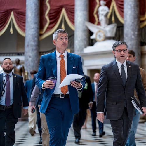 Transportation Secretary Sean Duffy, left, and Speaker of the House Mike Johnson, R-La., walk through Statuary Hall at the Capitol to a news conference on day 23 of the government shutdown, in Washington, Thursday, Oct. 23, 2025. (AP Photo/J. Scott Applewhite)