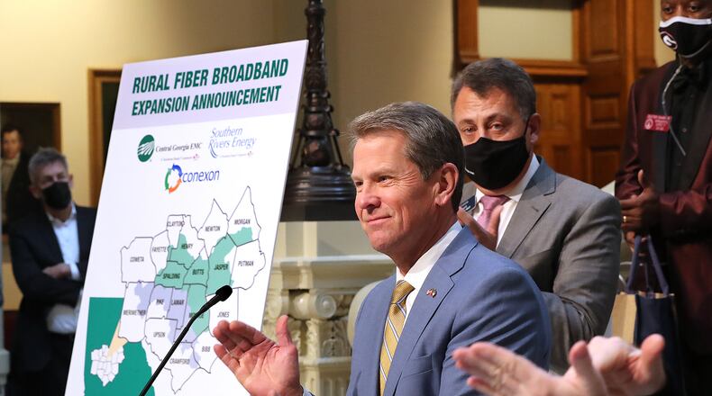 Gov. Brian Kemp applauds while speaking Monday during a press conference about expanding rural internet access in Georgia at the Capitol in Atlanta. Curtis Compton / Curtis.Compton@ajc.com”