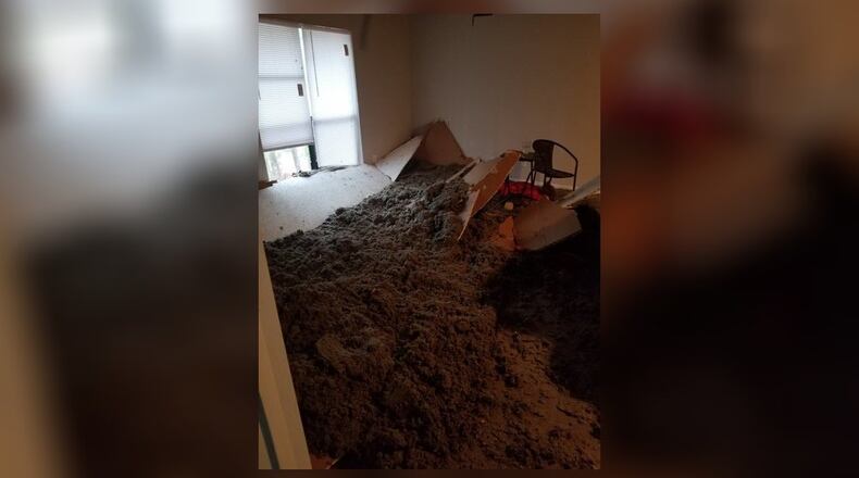 A Roswell woman said she was cooking breakfast Sunday morning when the ceiling of her apartment collapsed onto her head.