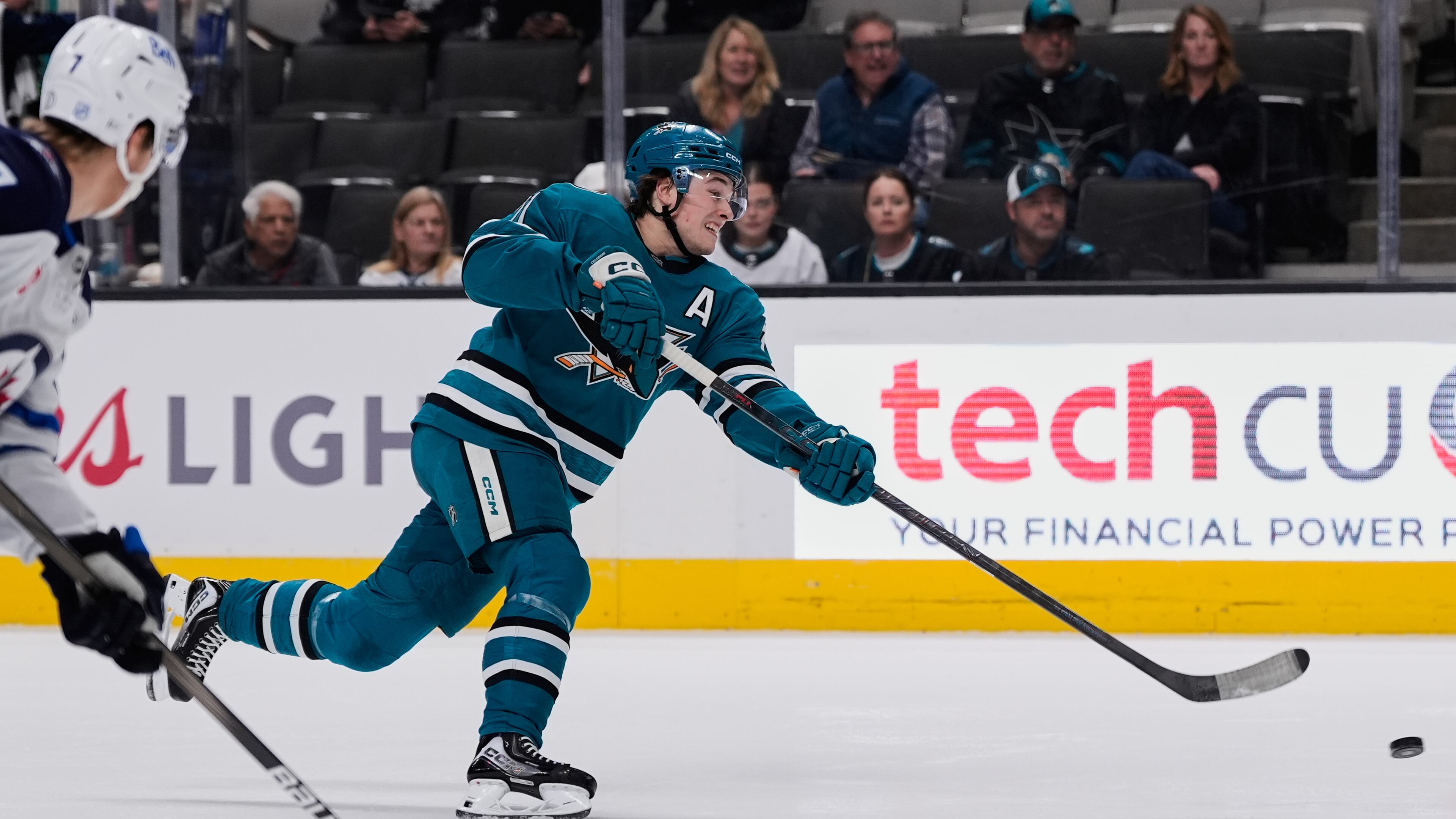San Jose Sharks center Macklin Celebrini (71) shoots during the first period of an NHL hockey game against the Winnipeg Jets, Friday, Nov. 7, 2025, in San Jose, Calif. (AP Photo/Godofredo A. Vásquez)
