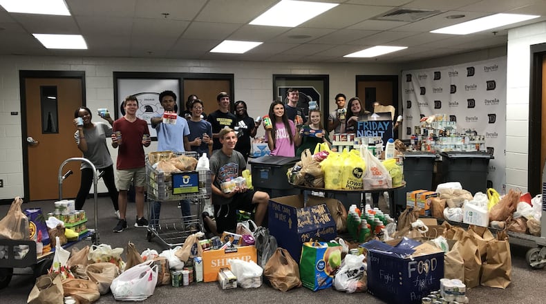 Dacula High School Student Council members take a break from weighing donations during the 2018 Food Fight. COURTESY OF SYDNEY BENSON/DACULA HIGH SCHOOL
