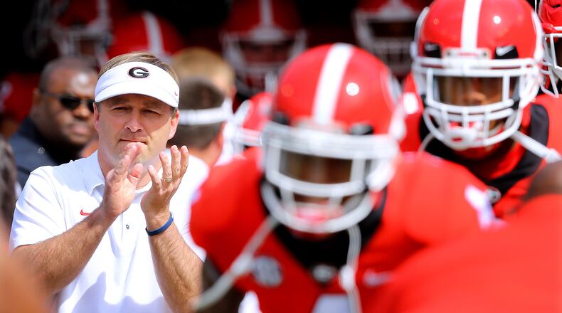 Kirby Smart and Georgia players take the field for the annual G-Day spring intrasquad football game Saturday, April 21, 2018, at Sanford Stadium in Athens. (Curtis Compton/Curtis.Compton@ajc.com)
