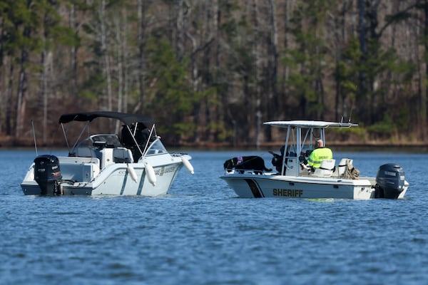 Members of local law enforcement agencies search for Gary Jones on Lake Oconee on Friday in Eatonton, Ga. The Putnam County sheriff is investigating and searching after Spelman College instructor Joycelyn Nicole Wilson and an Atlanta private school coach Gary Jones went missing on Lake Oconee over the weekend. The body of Wilson was found Sunday and Jones has not been found. (Jason Getz / AJC)