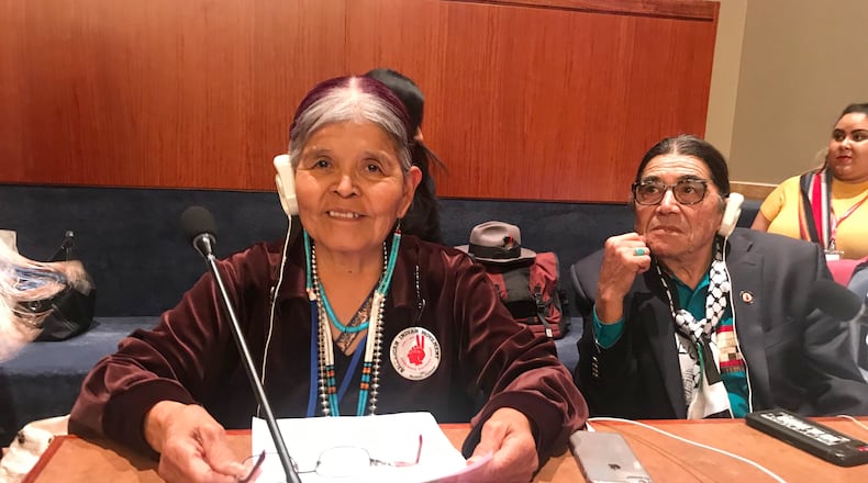 Jean Whitehorse testifies about forced and coerced sterilization of Native American women at the United Nations Permanent Forum on Indigenous Issues on April 2019, as Anthony Gonzales, right, executive director of the American Indian Movement listens. (Keely Badger via AP)