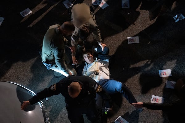FILE - Israeli police officers disperse ultra-Orthodox Jewish men blocking a highway during a protest against army recruitment in Bnei Brak, Israel, on Jan. 9, 2025. (AP Photo/Oded Balilty, File)