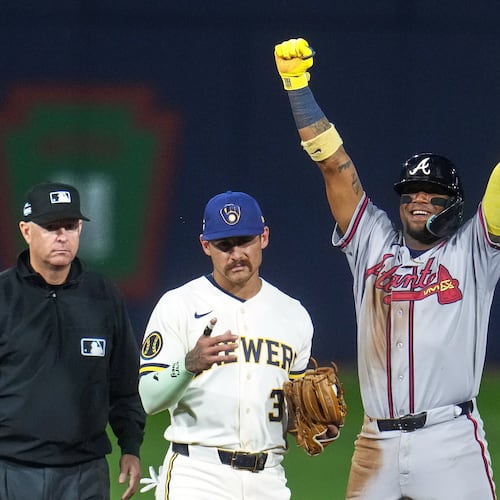 Atlanta Braves' Ronald Acuña Jr., right, celebrates next to Milwaukee Brewers shortstop Joey Ortiz (3) after stealing second base during the fifth inning of the Little League Classic baseball game in Williamsport, Pa., Sunday, Aug. 23, 2026. (AP Photo/Gene J. Puskar)