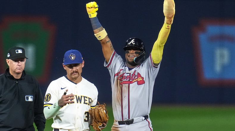 Atlanta Braves' Ronald Acuña Jr., right, celebrates next to Milwaukee Brewers shortstop Joey Ortiz (3) after stealing second base during the fifth inning of the Little League Classic baseball game in Williamsport, Pa., Sunday, Aug. 23, 2026. (AP Photo/Gene J. Puskar)