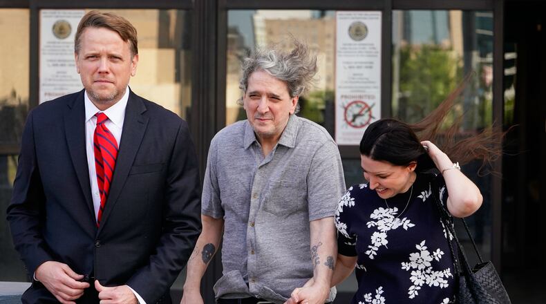 Former death row prisoner Richard Glossip, center, exits a detention facility alongside his wife Lea Glossip, right, after being granted bond while awaiting retrial Thursday, May 14, 2026, in Oklahoma City. (AP Photo/Nick Oxford)