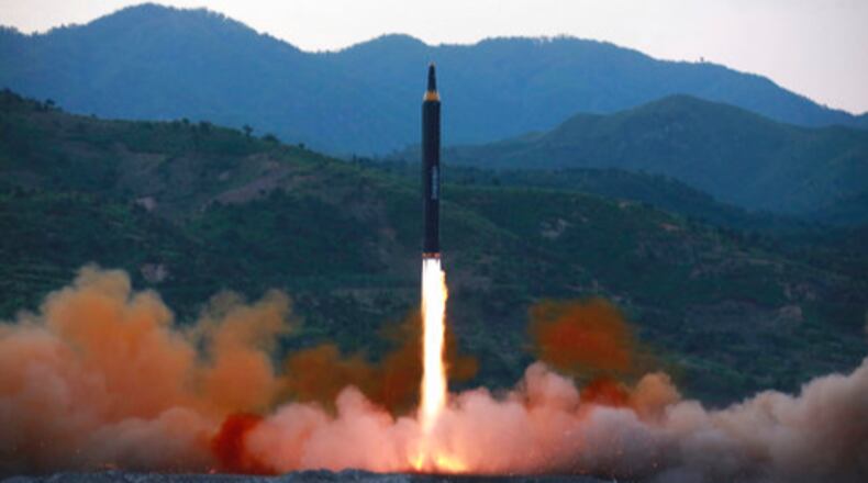 This May 14, 2017, photo distributed by the North Korean government shows the "Hwasong-12," a new type of ballistic missile at an undisclosed location in North Korea. North Korea on Monday, May 15, 2017, boasted of a successful weekend launch of a new type of "medium long-range" ballistic rocket that can carry a nuclear warhead. Outsiders also saw a significant technological jump, with the test-fire apparently flying higher and for a longer time period than any other such previous missile. Independent journalists were not given access to cover the event depicted in this photo. (Korean Central News Agency/Korea News Service via AP)