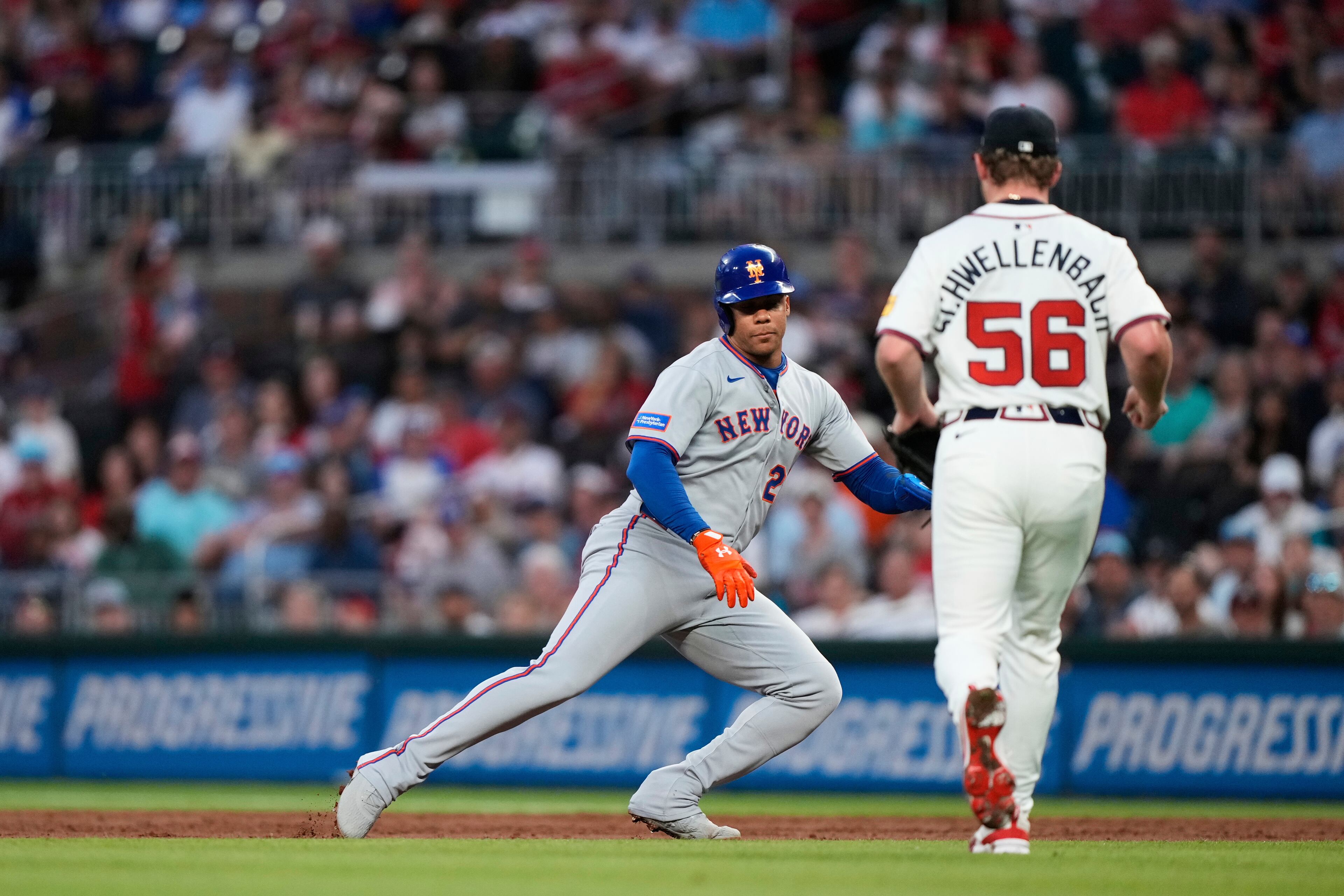 The New York Mets' Juan Soto (left) tries to avoid a tag during the second inning on Tuesday, June 17, 2025, in Atlanta. (Brynn Anderson/AP)