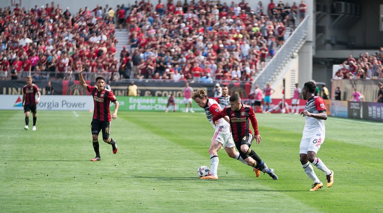 Atlanta United defender Greg Garza (4) battles D.C. United midfielder Jared Jeffrey (25) for ball control during Atlanta's 3-1 loss Sunday, April 30, 2017, at Bobby Dodd Stadium in Atlanta.