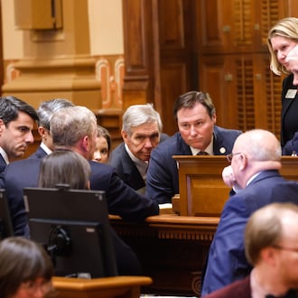 Leaders convene while the House is at ease at the House of Representatives on Sine Die, the last day of the legislature, at the Capitol in Atlanta on April 2, 2026. (Arvin Temkar/AJC)