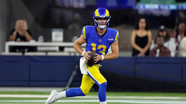 Los Angeles Rams quarterback Stetson Bennett runs against the Las Vegas Raiders during the first half of a preseason NFL football game Saturday, Aug. 19, 2023, in Inglewood, Calif. (AP Photo/Mark J. Terrill)