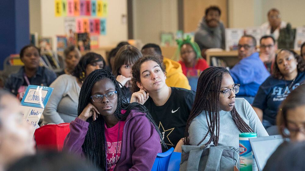 ABRUPT ENDING || March 13, 2020, Atlanta: Faculty and staff of Harper-Archer Elementary School listen as principal Dione Taylor instructs them on how they will operate while teaching from home. Atlanta Public Schools closed their facilities to students and staff due to the uncertainty of COVID-19. (ALYSSA POINTER/ALYSSA.POINTER@AJC.COM)