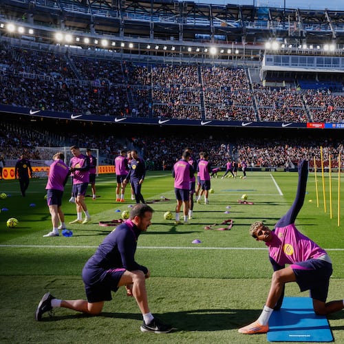 Barcelona's Lamine Yamal exercises during the team's first training session at the venue after its renovation at the Camp Nou stadium in Barcelona, Spain, Friday, Nov. 7, 2025. (AP Photo/Joan Monfort)