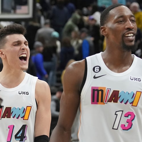 FILE - Miami Heat guard Tyler Herro (14) and center Bam Adebayo (13) celebrate Herro's game-winning shot at the end of the team' NBA basketball game against the Utah Jazz, Saturday, Dec. 31, 2022, in Salt Lake City. (AP Photo/George Frey, File)