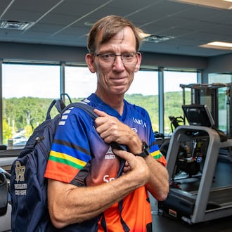 Keith Hooper, a Spanish teacher and running coach at River Ridge High School in Woodstock, spent hours at Northside Hospital Cherokee's rehabilitation facility in Canton for physical therapy after suffering a heart attack in class and undergoing a quadruple bypass in January. (Jenni Girtman for the AJC)