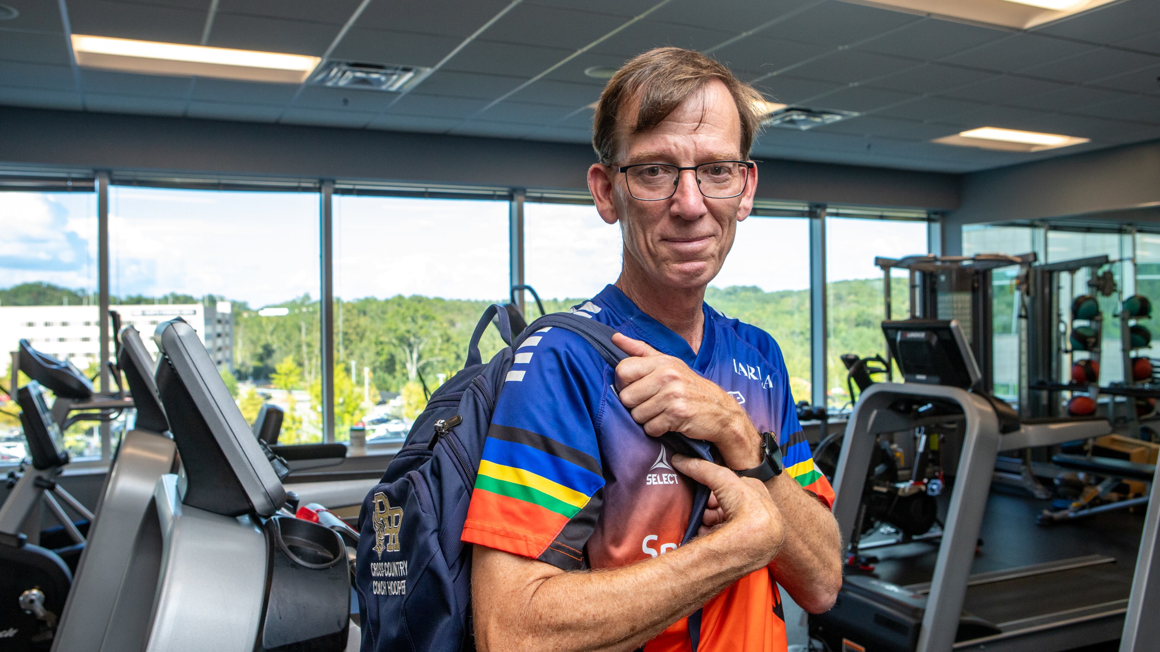 Keith Hooper, a Spanish teacher and running coach at River Ridge High School in Woodstock, spent hours at Northside Hospital Cherokee's rehabilitation facility in Canton for physical therapy after suffering a heart attack in class and undergoing a quadruple bypass in January. (Jenni Girtman for the AJC)