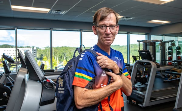 A close call followed by quadruple bypass surgery taught high school running coach Keith Hooper the importance of being positive.