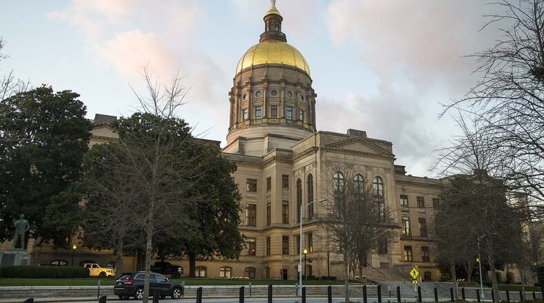 The sun sets at the Georgia State Capitol building in Atlanta, Monday, January 27, 2020. (ALYSSA POINTER/ALYSSA.POINTER@AJC.COM)