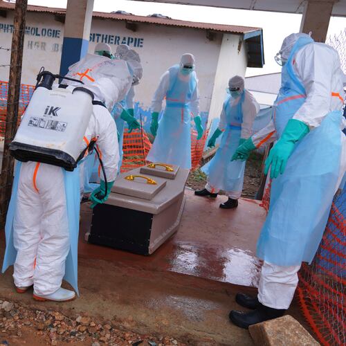Health workers disinfect a coffin of an Ebola victim at Ebola Treatment Center at Bunia General Hospital in Ituri, Congo, Wednesday, July 22, 2026. (AP Photo/Dirole Lotsima Dieudonne)