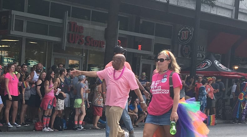 U.S. Rep. John Lewis greets the crowd at the Atlanta Pride parade. AJC/Greg Bluestein