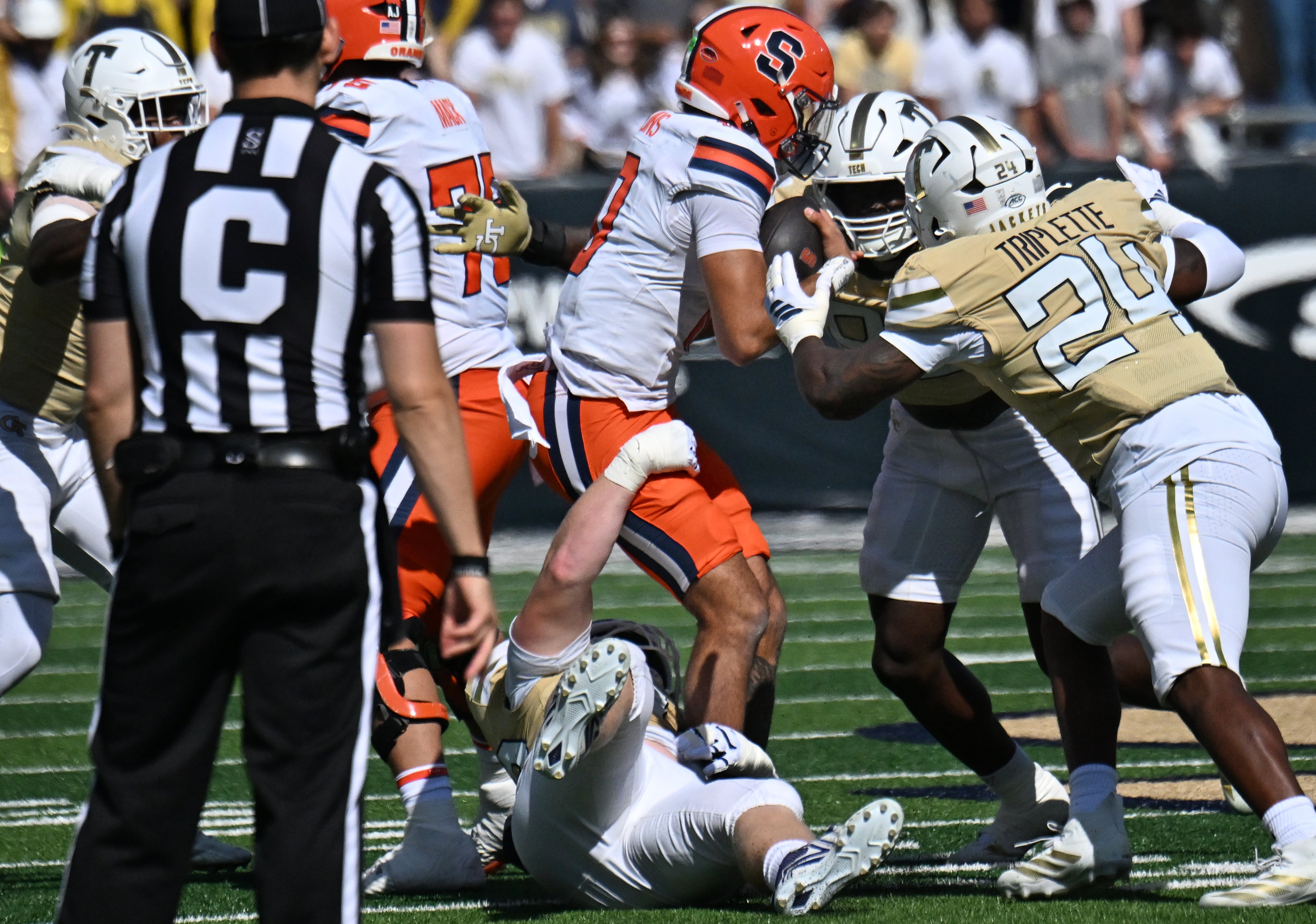 Syracuse quarterback Rickie Collins (10) is sacked by Georgia Tech defensive tackle Jordan van den Berg (99) during the first half of an NCAA college football game at Bobby Dodd Stadium, Saturday, October 25, 2025 in Atlanta. (Hyosub Shin / AJC)