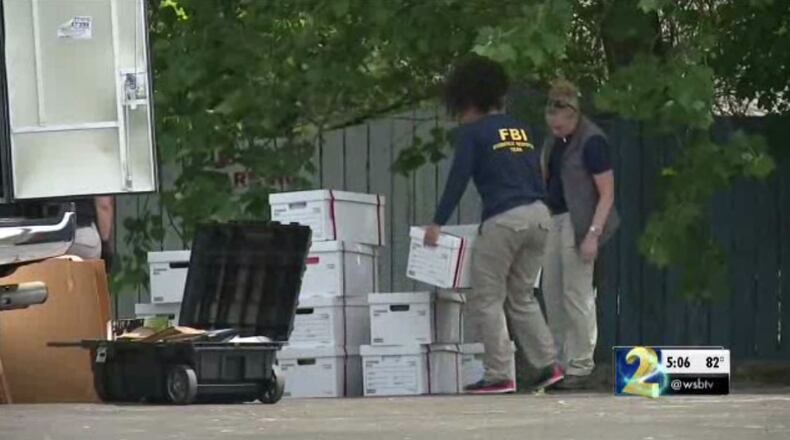 Federal agents seize documents from homes and business belonging to a Bartow County man arrested Tuesday for his alleged role in a tax-dodging scheme.