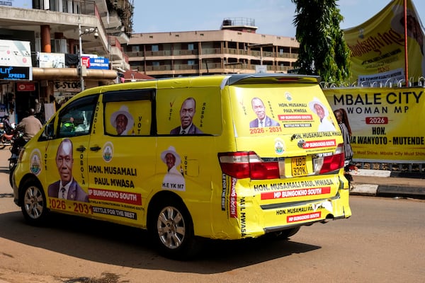 A political campaign van bearing the image of Paul Musamali, a candidate for Member of Parliament for Bungokho South, drives through downtown Kampala, Uganda, Tuesday, June 24, 2025. (AP Photo/Hajarah Nalwadda)