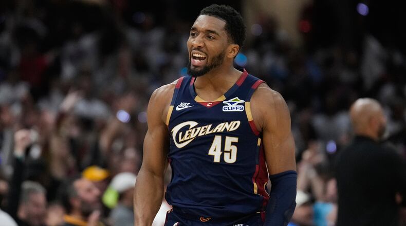 FILE - Cleveland Cavaliers' Donovan Mitchell (45) gestures after hitting a three-point basket inthe second half of Game 4 of a second-round NBA basketball playoff series against the Detroit Pistons, May 11, 2026, in Cleveland. (AP Photo/Sue Ogrocki, File)