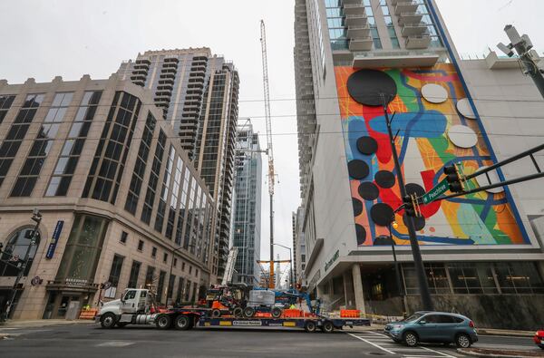 Several blocks of Midtown are closed as crews work to disassemble the crane, which malfunctioned Friday morning. 