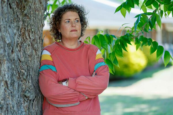 Shea Hutchinson, a local resident and former candidate for the Bacon County Commission, stands near the construction site where Silicon Ranch is building one of the largest solar farms in the state outside Alma in April. She has expressed her opposition at every board meeting she’s attended. (Miguel Martinez/AJC)