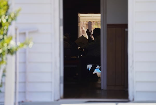 Rodney Ivey keeps time while singing from the tenor section at a Sacred Harp singing event at Holly Springs Primitive Baptist Church in Bremen, Ga., on Sunday, March 23, 2025. (AP Photo/Jessie Wardarski)