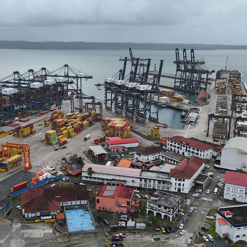 FILE - Cranes load and unload containers from cargo ships at the Cristobal port, operated by the Panama Ports Company, in Colon, Panama, Feb. 6, 2026. (AP Photo/Matias Delacroix, File)