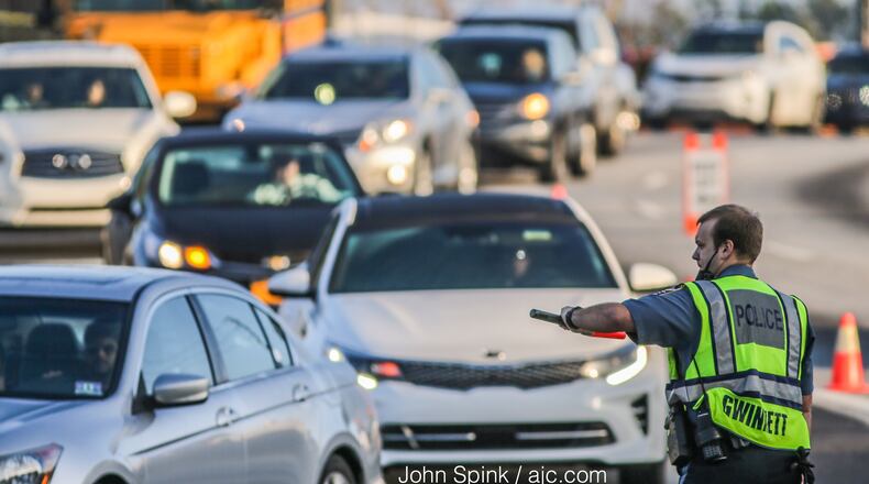 A file photo from a 2017 crash at the intersection of Jimmy Carter and Peachtree Industrial boulevards in Gwinnett County. JOHN SPINK / JSPINK@AJC.COM
