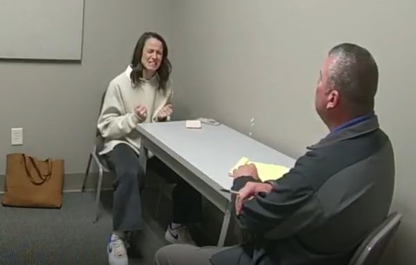 During her interview with then-Sgt. Anthony Sims on Feb. 29, 2024, Hayle Swinson grimaced while recounting a sexual encounter with Bradley Reynolds. During the interview, she presented the police with a stack of printouts of emails, most from Reynolds. (Courtesy of the White County Sheriff's Office)