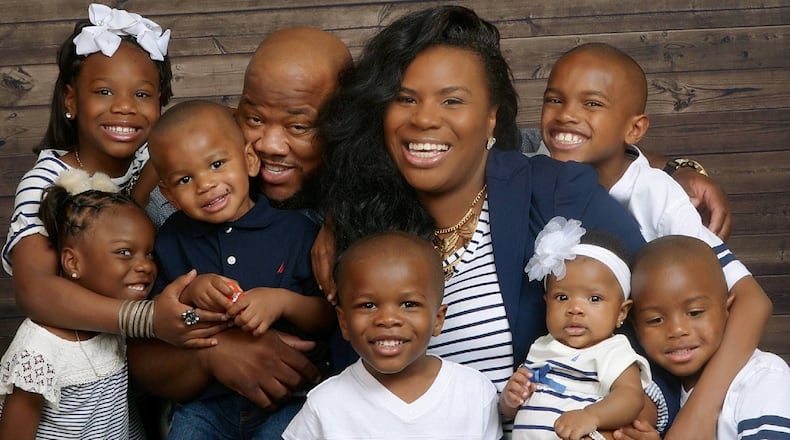 Shanna Sanon, shown with her husband and seven children, was pregnant with her eighth child in this family photo. Photos were among the items lost when the family's U-Haul truck was stolen from a hotel parking lot.