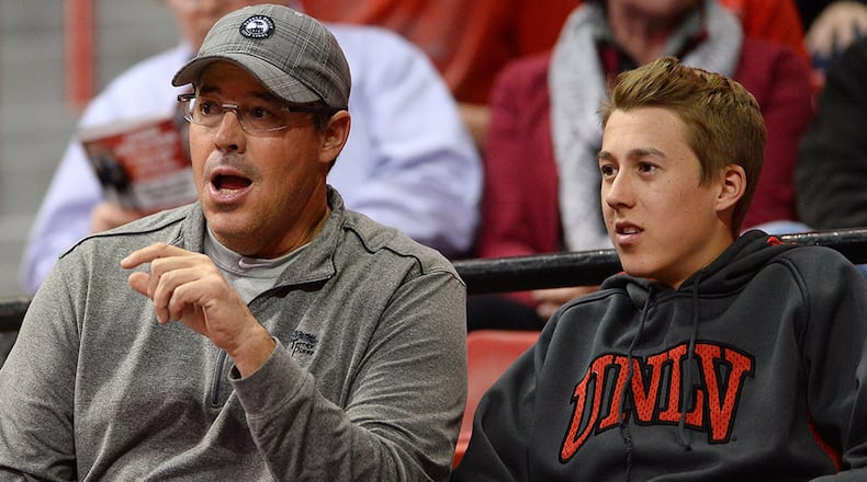 Greg Maddux (left) and his son, Chase, attend a UNLV Rebels basketball game. Chase is now a sophomore on the Rebels' baseball team.