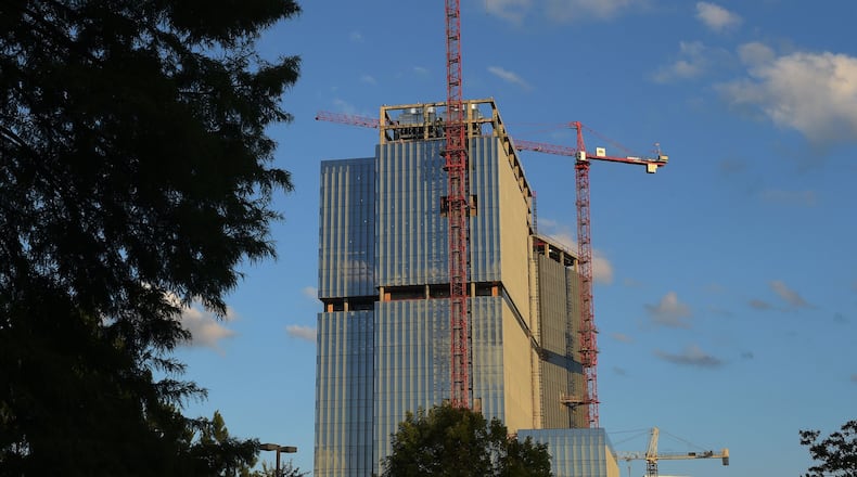 The State Farm tower rises along Hammond Drive in Dunwoody. State Farm and developer KDC are seeking $48.6 million in tax incentives not just for future Dunwoody office buildings, but for a tower that’s already nearly complete. KENT D. JOHNSON/kdjohnson@ajc.com
