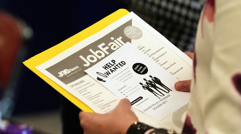 FILE - A job seeker waits to talk to a recruiter at a job fair Aug. 28, 2025, in Sunrise, Fla. (AP Photo/Marta Lavandier, File)